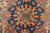 Navy and red center medallion detail with gold palmettes, ivory ground and tight wool knots