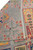 8'4" x 9'11" Pakistani Kazak rug folded back to reveal dense hand-knotted wool pile