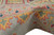 Thick wool pile rolled to show saffron yellow and pink border motifs on grey ground