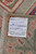 Reverse side with maker label confirming hand-knotted construction in Pakistan using 100% natural wool