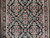 Close view of field pattern: pink and blue flower heads in an ivory-outlined lattice on black