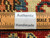 Back of rug with ruler and Authentic Handmade label confirming hand-knotted wool construction and knot density
