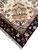 Corner fringe with ivory border flowering plant motif in coral, gold and black stems