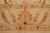 Border detail showing golden tan palmette, rust lotus blossoms and lavender rosette guard stripe