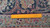 Reverse of 7x10 Tabriz rug with ruler showing tight even knots per square inch