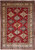 Ruby red Super Kazak rug with ivory borders and all-over stepped diamond medallions in blue