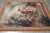Angled floor view of the flat weave tapestry with light catching the ribbed ivory sky