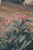 Hand-woven pink roses and blue green foliage detail showing fine tapestry weft shading