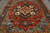 8'9" x 11'9" India Serapi rug with serrated navy star medallion over a coral red field