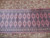 2'7 x 18'4 Pakistan Jaldar rug close-up, pink diamond guls outlined in charcoal and ivory