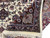 8'2" x 10' Oriental rug corner folded back to show dense wool pile and fringe