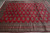 Wide end view of the 8' x 11' rug showing its stacked multi-band border system