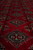 Low angle macro showing plush silky wool pile and octagonal elephant foot gul motifs