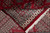 Folded corner revealing the tight back weave, cotton fringe and fine border knotting