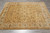 8' x 10'2" hand-knotted Indian rug displayed on grey tile showing all-over floral design