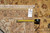 Back of the rug with hand-woven tag reading F-4403 and tape measure for scale