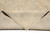 8x10 rug folded back to reveal even hand-knotted foundation and durable cotton weave