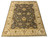 Angled studio shot showing gray all over floral field framed by wide cream palmette border