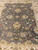 Close top-down section of the field with lotus palmettes, rosettes and gold vine tracery