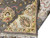 Folded back corner showing reverse knotting, cotton foundation and the gray and ivory face