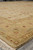 Low angle corner view highlighting warm beige tones and layered floral border bands