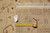 Rug back with inventory tag and tape measure confirming hand-knotted 8x10 wool construction
