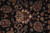 Black ground field close-up with large rust palmettes, green vines and ivory accent flowers