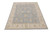 Soft slate blue field with cream vine scrolls, ideal 8x10 living room Oriental rug