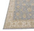 Corner detail showing ivory guard stripes, flat selvage and hand-knotted wool pile density