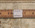 Reverse weave with ruler and partial tag reading authentic handmade, showing knot row detail