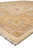 Corner shot showing ivory fringe, layered borders and the plush depth of natural wool pile