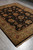 Full 8' x 10' Jaipur wool rug shown lengthwise on polished grey concrete floor