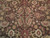 Close-up of all-over palmette and leaf field in espresso brown, gold and crimson wool