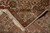 Folded corner showing cotton foundation, tight dense weave and ivory hand-tied fringe of Jaipur rug