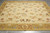 Overhead view of French Country flat weave rug showing tulips, bellflowers and gold floral border