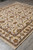 Brand new 8' x 9'10" Indian wool rug displayed diagonally on grey tile floor