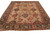 9x11 hand-knotted wool rug in tan with brown green border on white studio background, full view