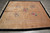 7'11" x 8'6" hand-knotted beige wool rug with five pink peony sprays on lattice field