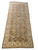 Angled view of the hand-knotted brown Chobi rug showing gallery proportions and ivory outer border