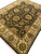 8x10 Jaipur wool rug seen from one corner, black field and ivory palmette border