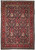 Navy blue Persian Sarough rug with dense all over floral vine field and red floral border