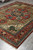 8x10 Serapi rug seen from one end, camel field with geometric medallion and pendants