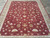 Rug seen lengthwise from one end, full border frame and all-over floral field