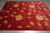 Angled floor view showing the full length and the striation running through the red ground