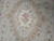 Overhead detail of the central cartouche filled with pink and ivory flower bouquets