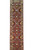 Full length of the rust Mahal runner showing repeating diamond medallions and brown border