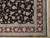 Corner detail showing border layers meeting, sage stripe, burgundy flowers and white fringe