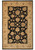 Full overhead view of the whole rug, black floral field framed by wide ivory palmette border