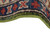 Curled edge showing the light green selvedge binding and the indigo and red outer guard band