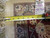 Tape measure and dealer tag marked rug number 5345 held against the pile near the fringe